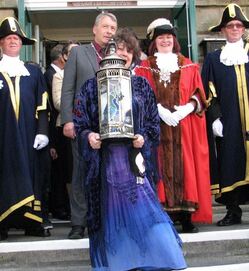 Morgana West and the Unity Candle lead the Mayor's Parade. Glastonbury.