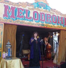 Morgana West and the Glastonbury Unity Candle on the Melodrome Stage. Glastonbury.